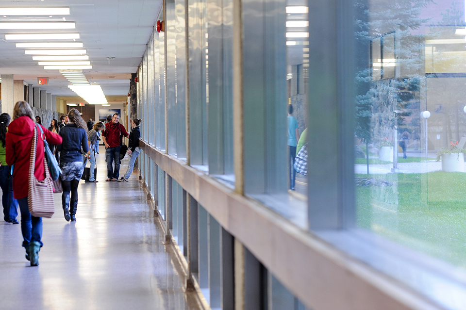 Students walking in a campus building 